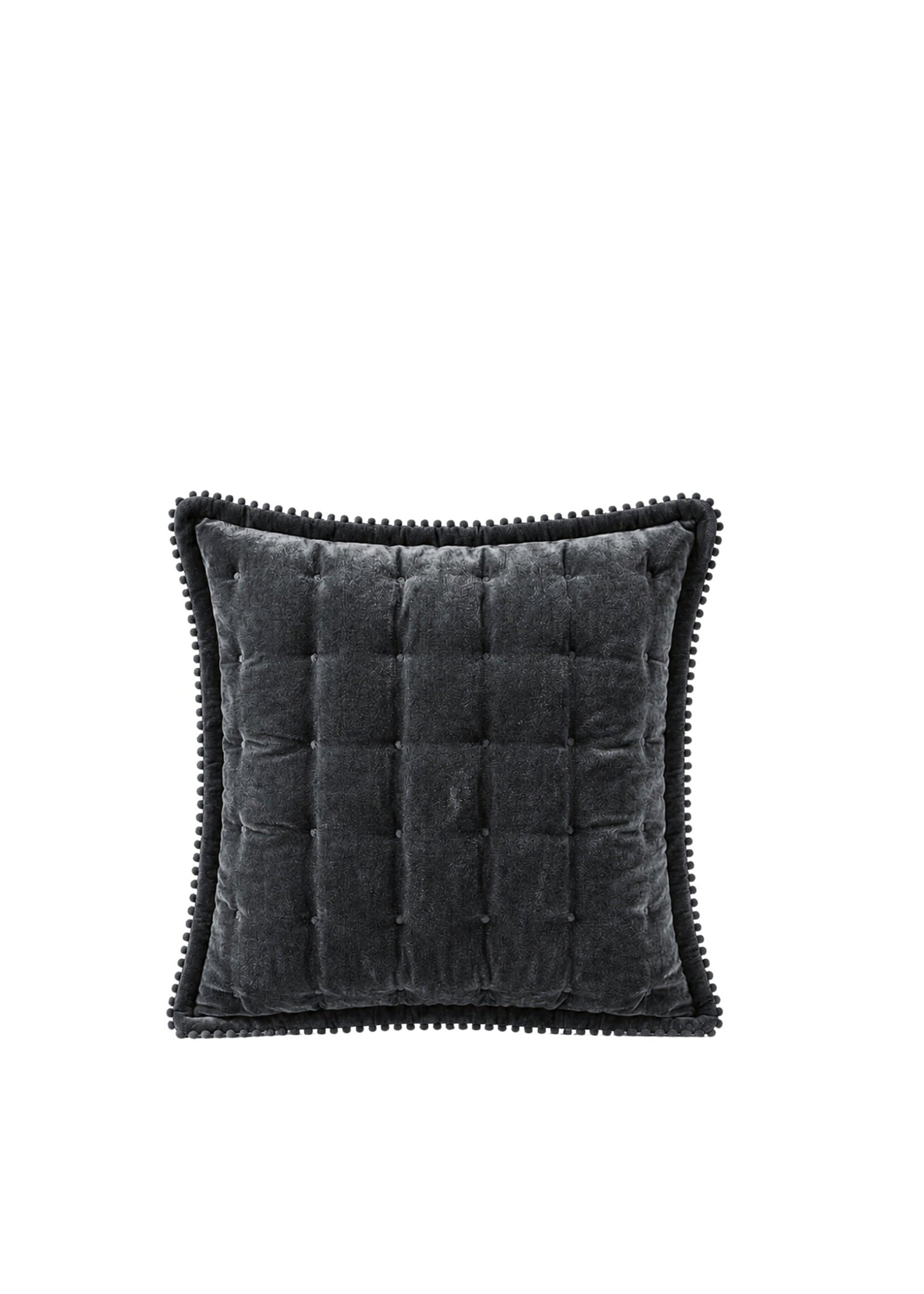 A square dark gray velvet throw pillow with a tufted center and black pom-pom trim, shown against a plain white background.