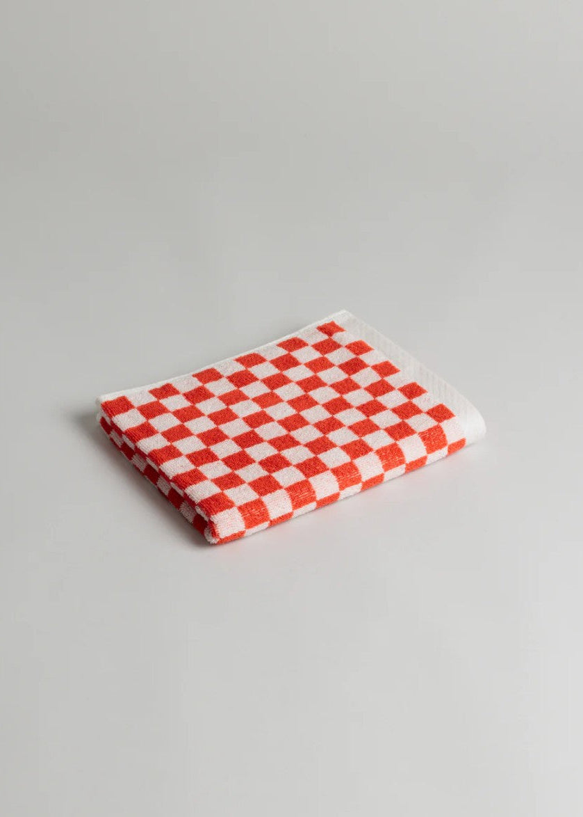 Red and white checkered towel on a gray background