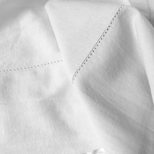 Close-up of white fabric with stitching detail