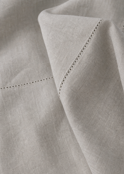 Close-up of light gray fabric with a subtle pattern