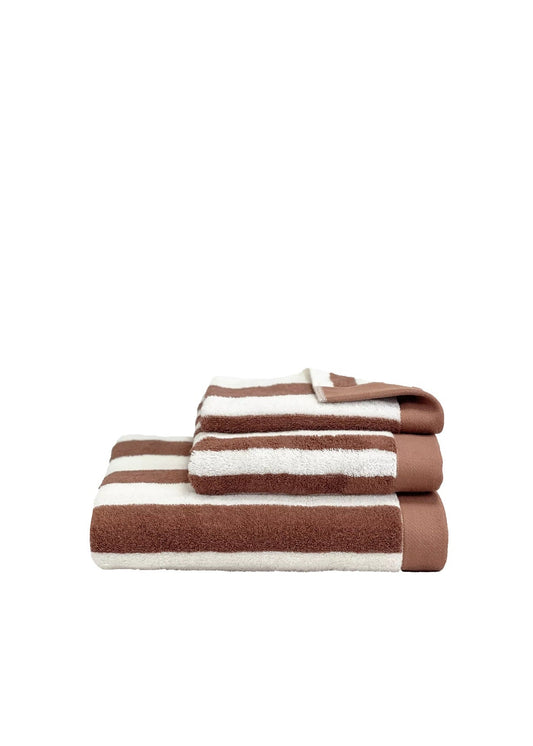 A set of three folded striped towels in brown and off-white, arranged by size on a plain white background.