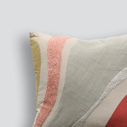 Decorative pillow with geometric pattern on a light gray background