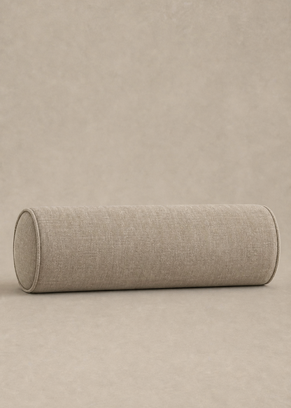 A cylindrical floor cushion with a textured beige linen fabric, shown on a matching neutral beige background.