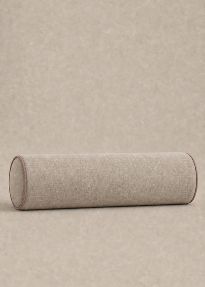 A cylindrical floor cushion in a light beige textured fabric, shown from a side profile view against a matching beige background.