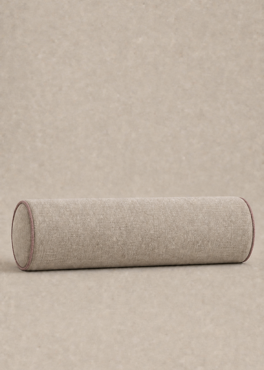A cylindrical floor cushion in a light beige textured fabric, shown from a side profile view against a matching beige background.