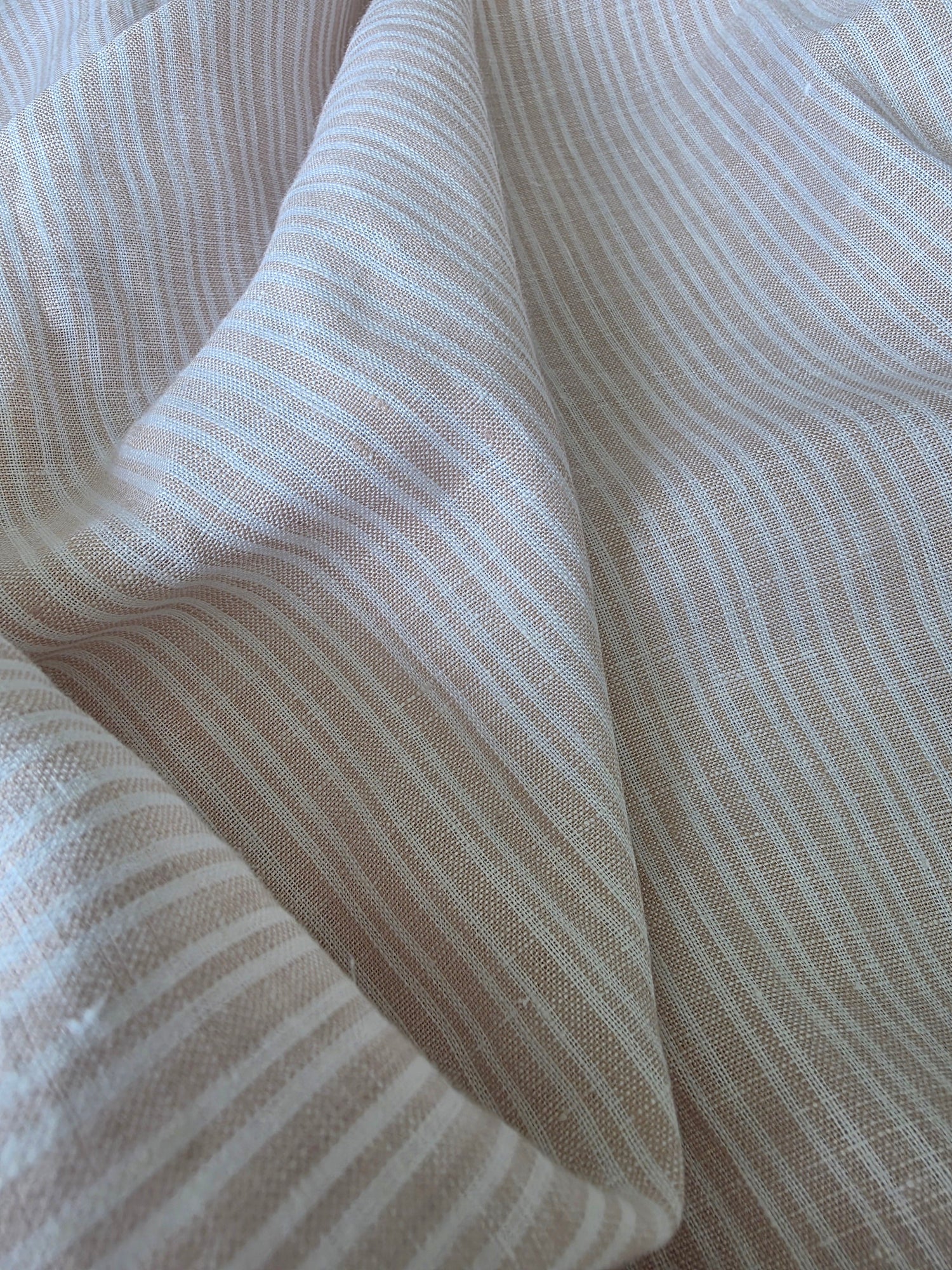 Close-up of striped fabric with a neutral color palette