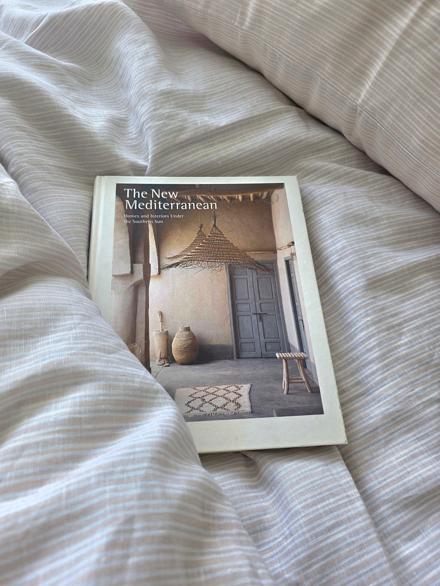 Book titled 'The New Mediterranean' on a textured surface