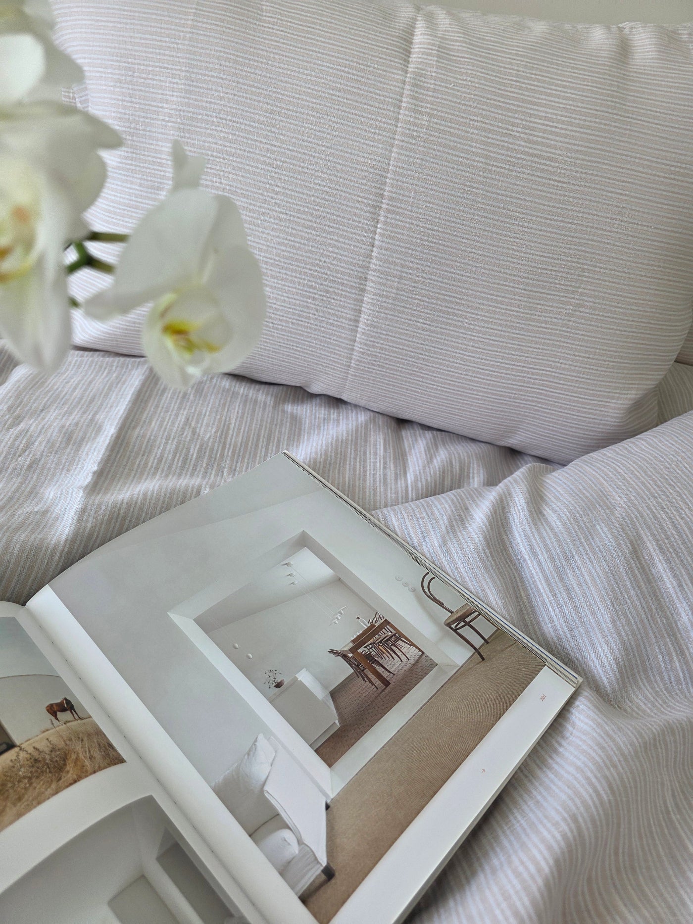 White decorative box on a textured white surface with a blurred background