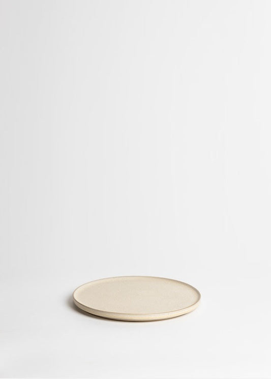 Beige ceramic plate on a white background