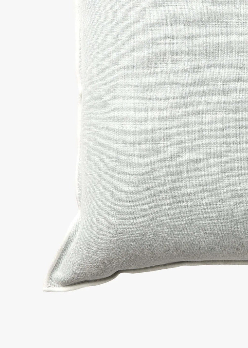 A square throw pillow in a light sage green linen fabric, shown against a plain white background.
