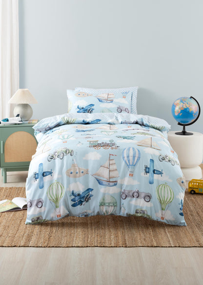 Children's bed with airplane, boat, and hot air balloon pattern in a room setting.