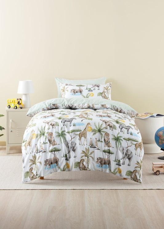 Children's bedding set with animal pattern on a bed in a room.