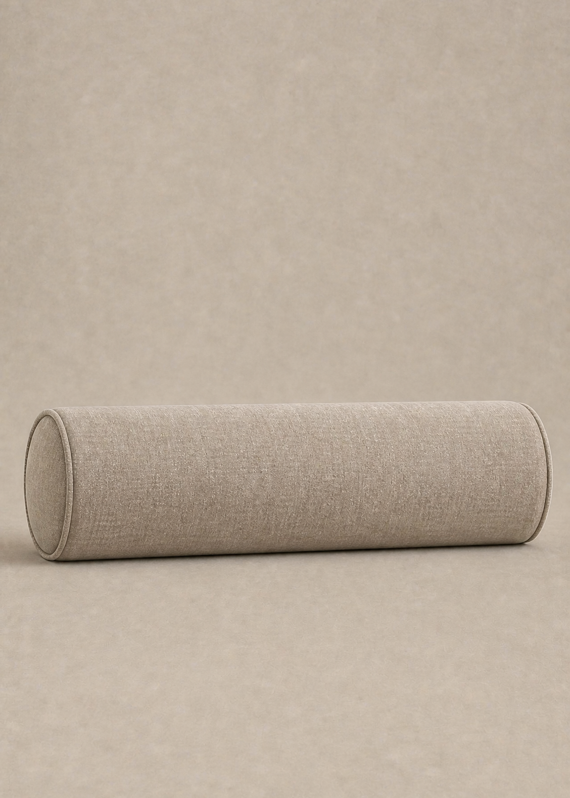 A cylindrical bolster pillow with a textured beige linen fabric cover, resting horizontally on a matching beige textured background.