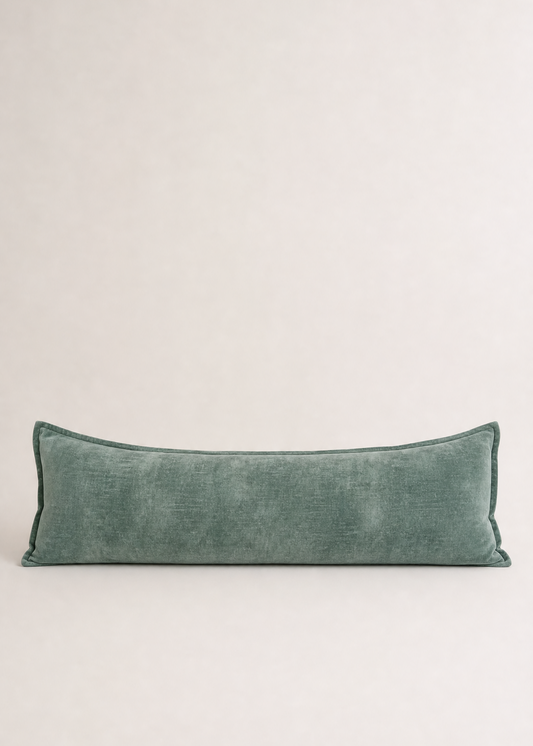 Green pillow on a light gray background