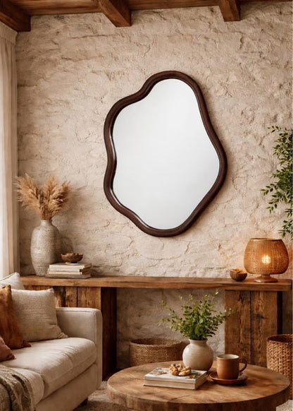 Cozy living room with a textured wall, wooden mirror, and decorative items.