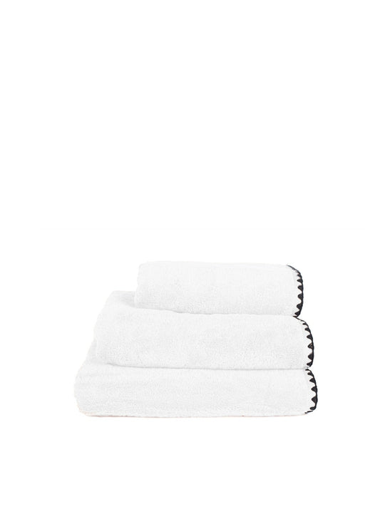 Black belt with silver zipper design on a white background