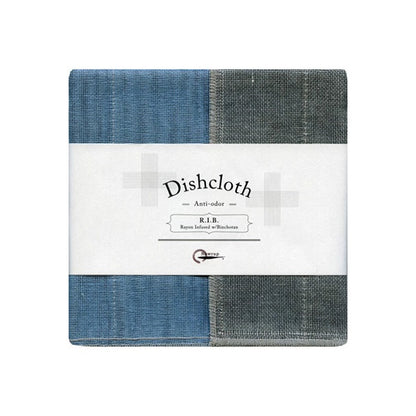 A two-tone dishcloth in blue and gray, with a textured surface, packaged in a box with the text 'DISHCLOTH AQUA' and the brand name 'RIN'.
